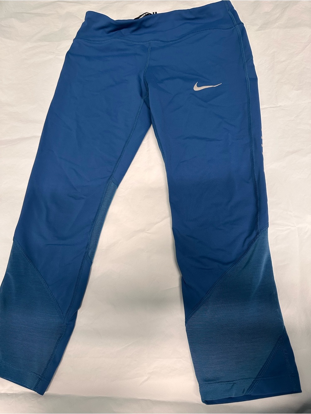 Nike women’s ' Blue Capri Leggings with Silver Swoosh